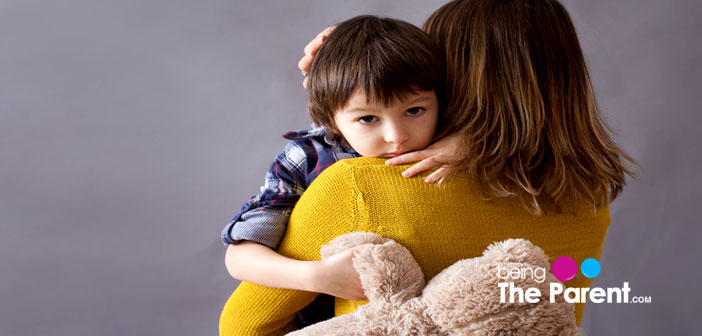 Child clings to mom