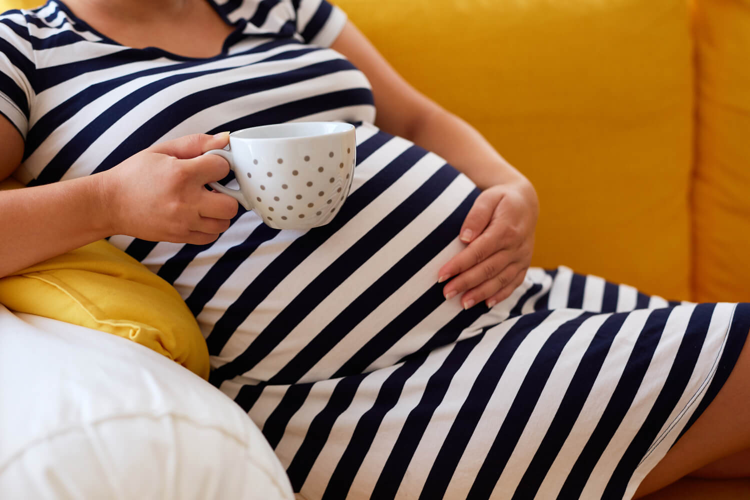 pregnant woman with coffee