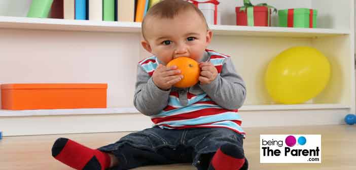 toddler having orange