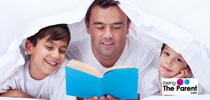 Father reading to boys