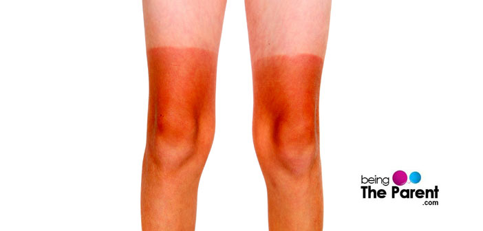 Sun tanned legs of a child