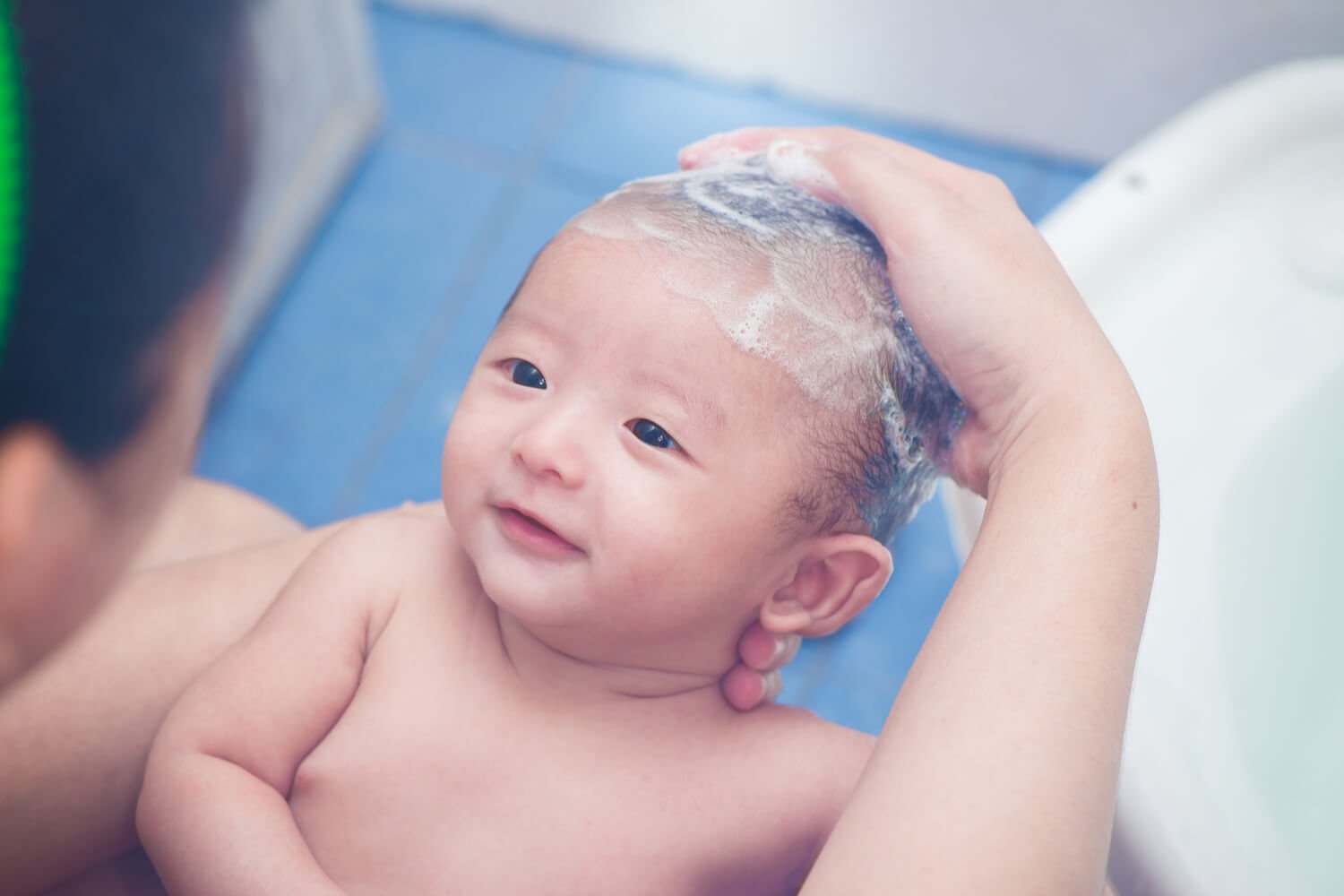 Washing The Baby's Hair Being The Parent