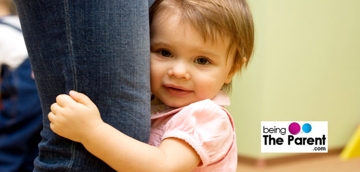 Toddler tugging at mother