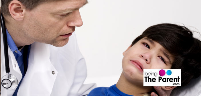 Unhapy child with doctor