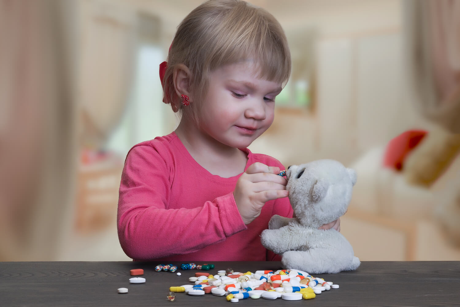 little girl playing with medicines