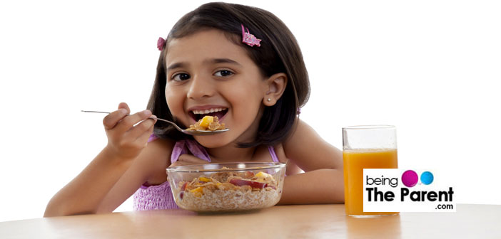 Girl eating breakfast cereal