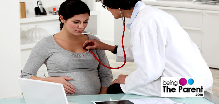 Pregnant woman with doctor