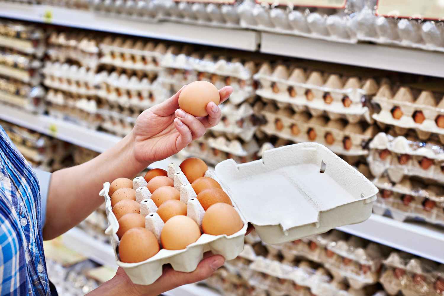 women selecting eggs from shop