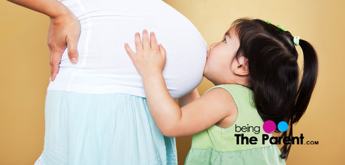 Pregnant woman with daughte