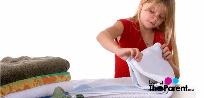 Girl folding laundry