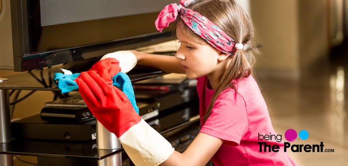 Child helps in dusting