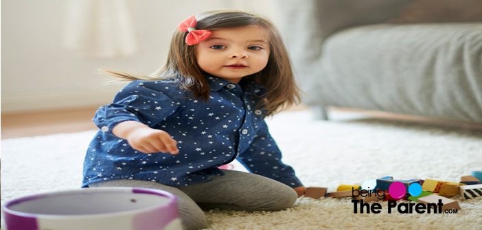 Child puts toys in basket