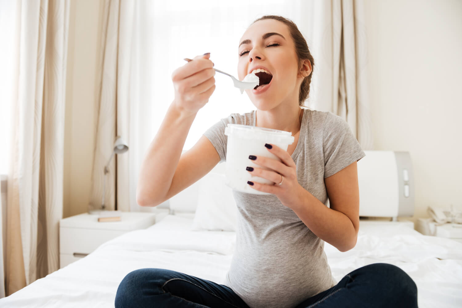 pregnant woman eating ice cream