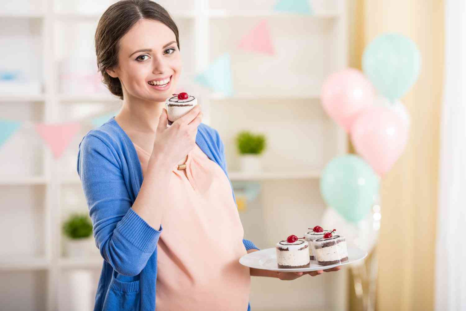 pregnant women eating cake