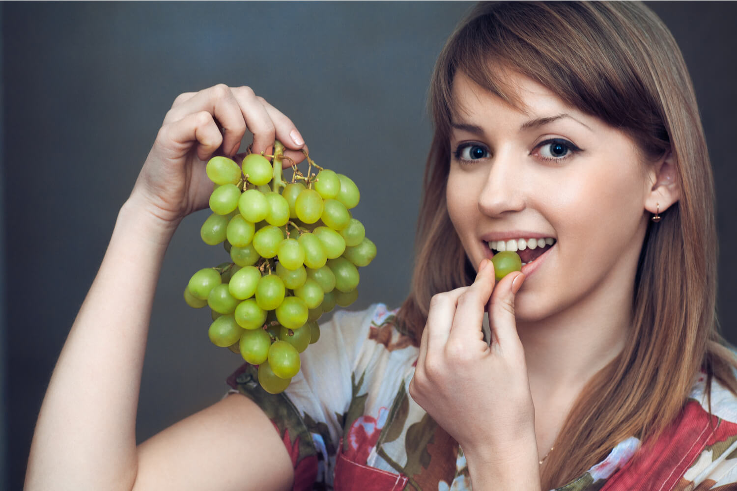 woman eating grapes