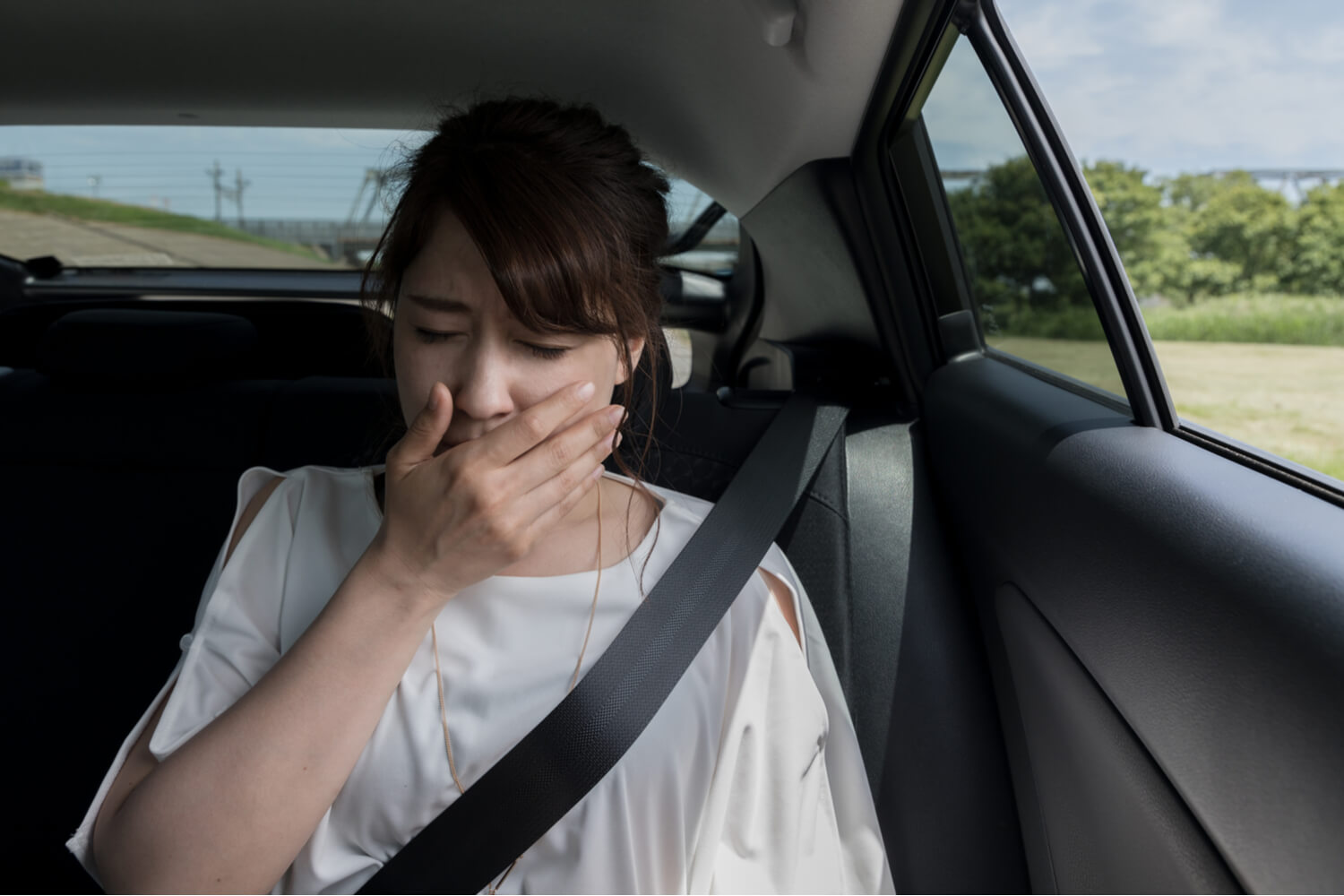 women having car sickness