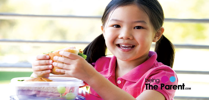 Schoolgirl eats lunch