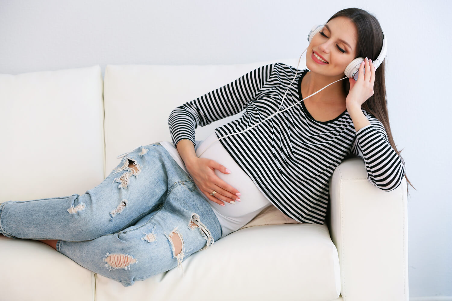 Woman Listening To Music During Pregnancy