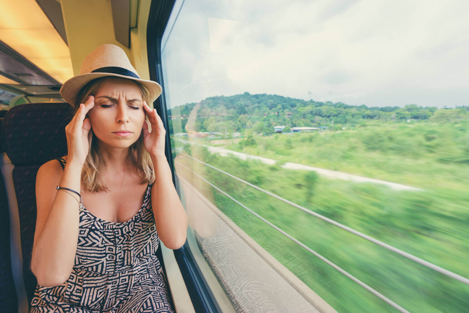 Headache in train symptom of motion sickness