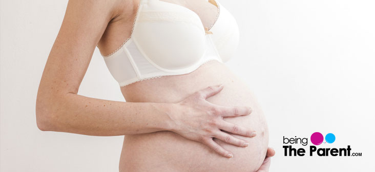pregnant woman in bra