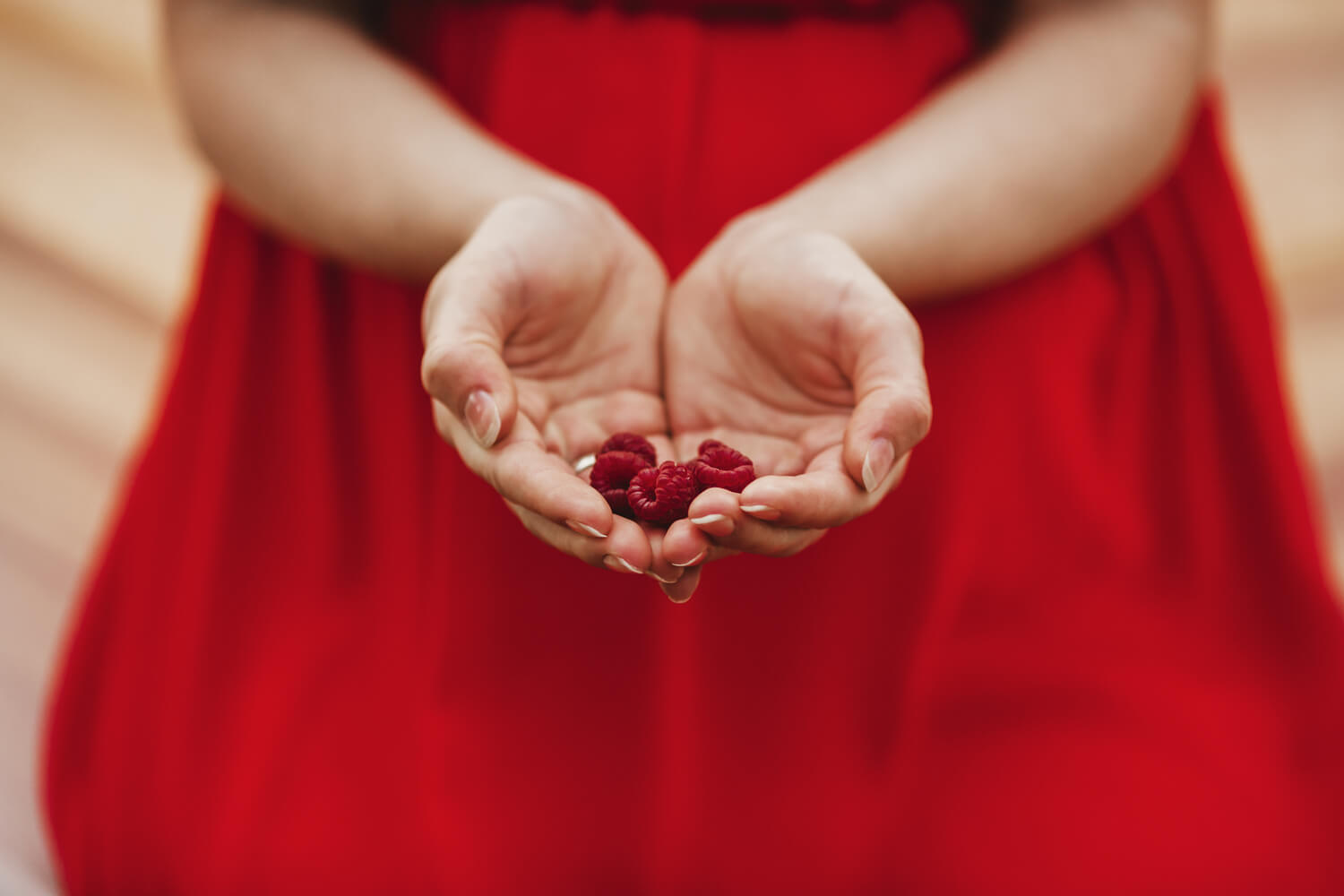 raspberry in woman hands
