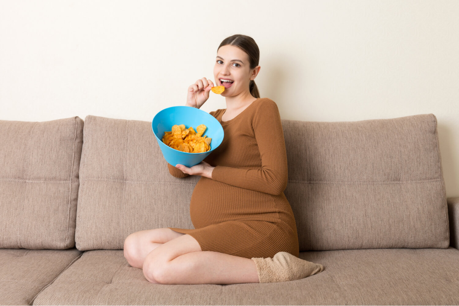 Pregnant women eating potato chips