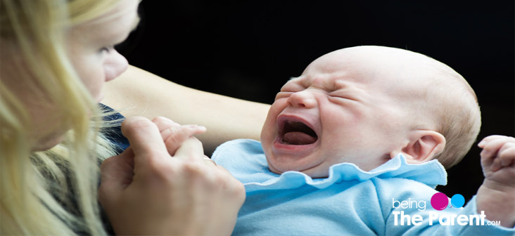 baby crying at breast