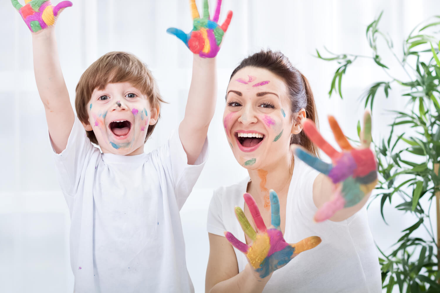 Child painting with mom