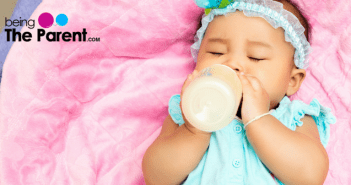 When can a baby hold her bottle and top tips to help her with it Baby Hold Bottle