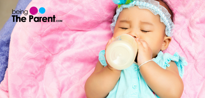 When can a baby hold her bottle and top tips to help her ...