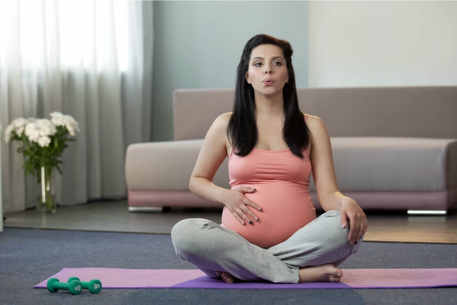 pregnant women doing breathing exercise