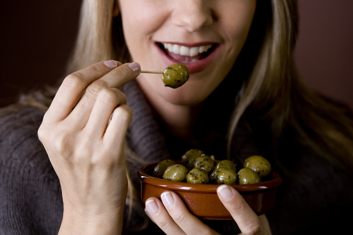 woman eating olives