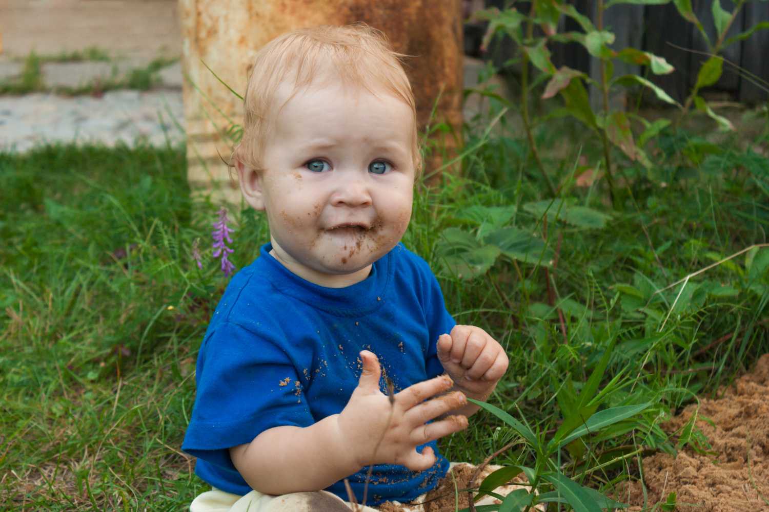 kid eating mud