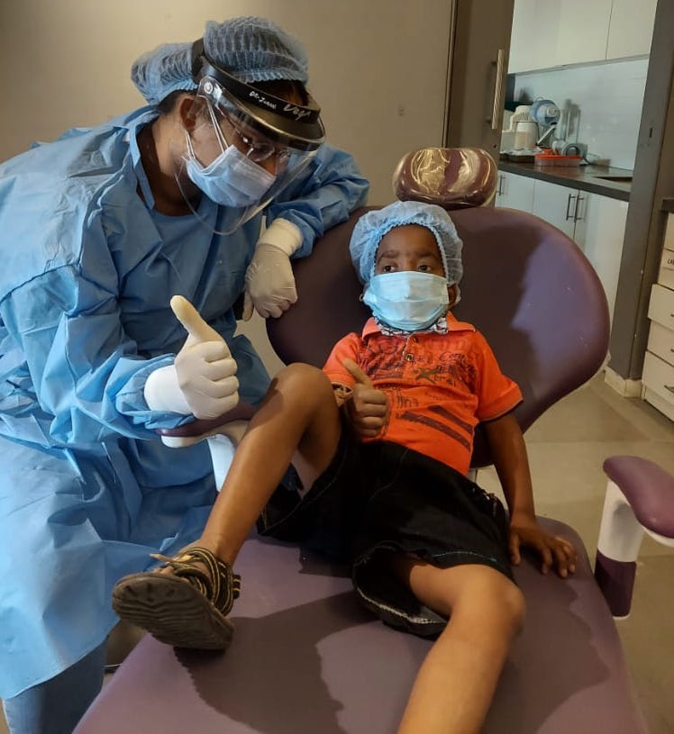 dentist with a happy kid