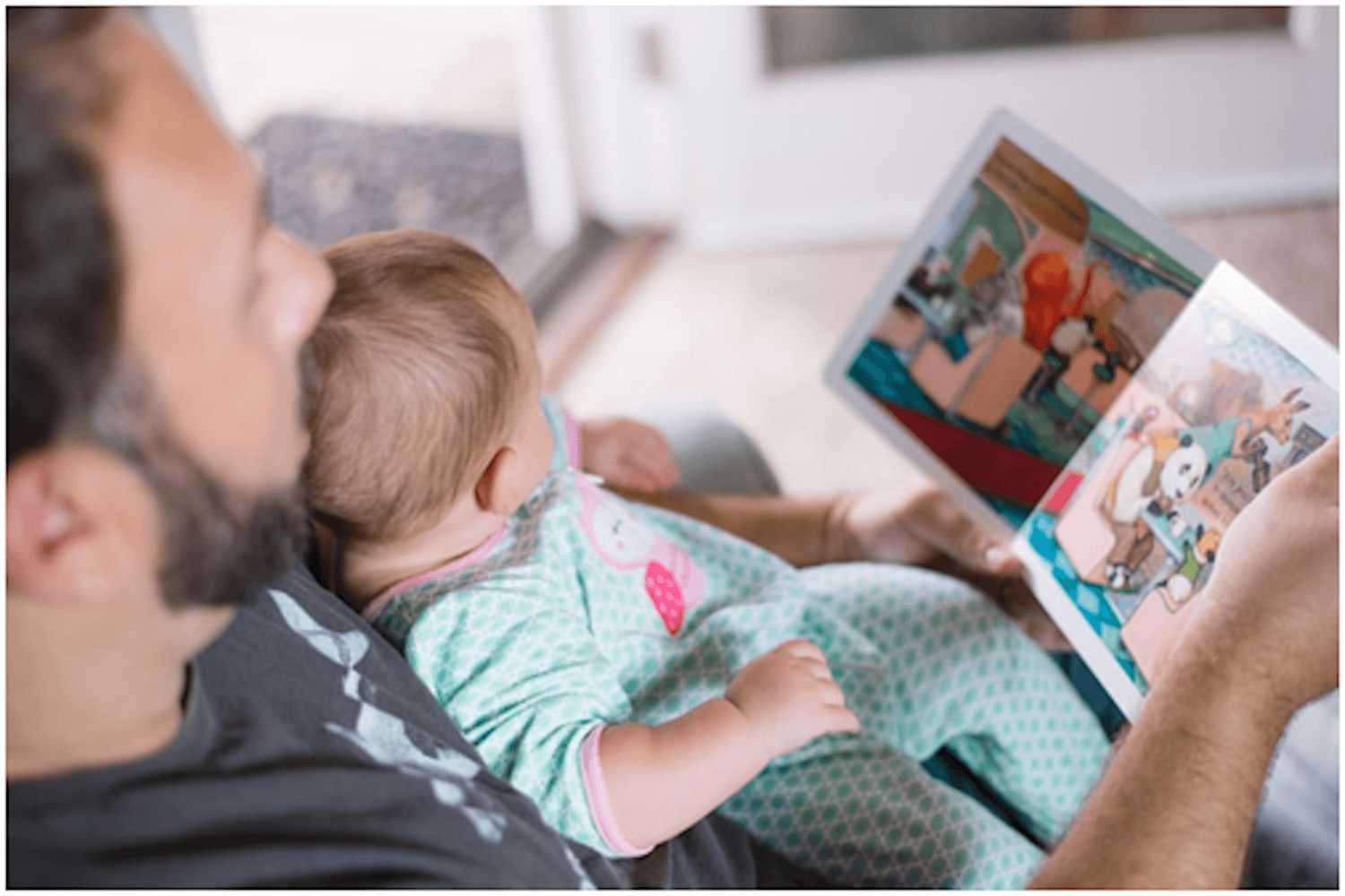 dad reading story to baby