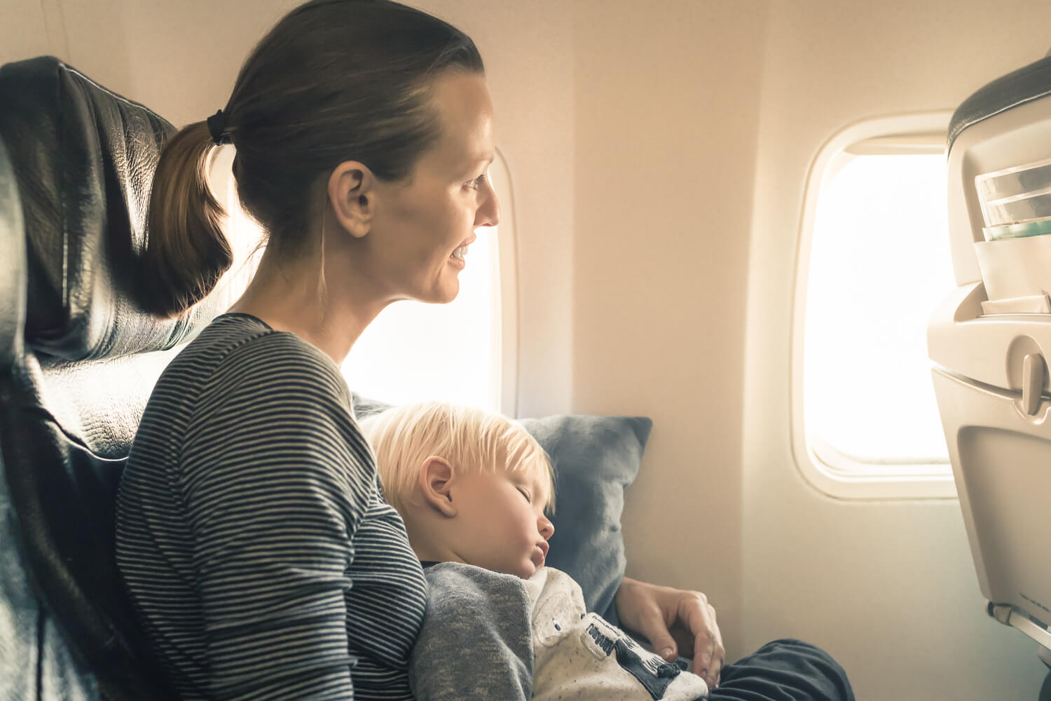 mom and toddler flying in flight