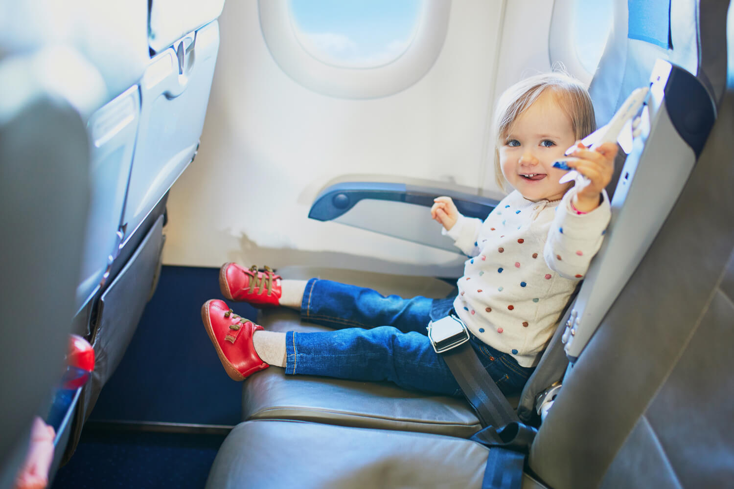 toddler playing in a flight