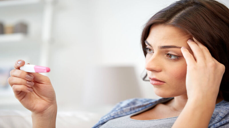 women checking pregnancy test