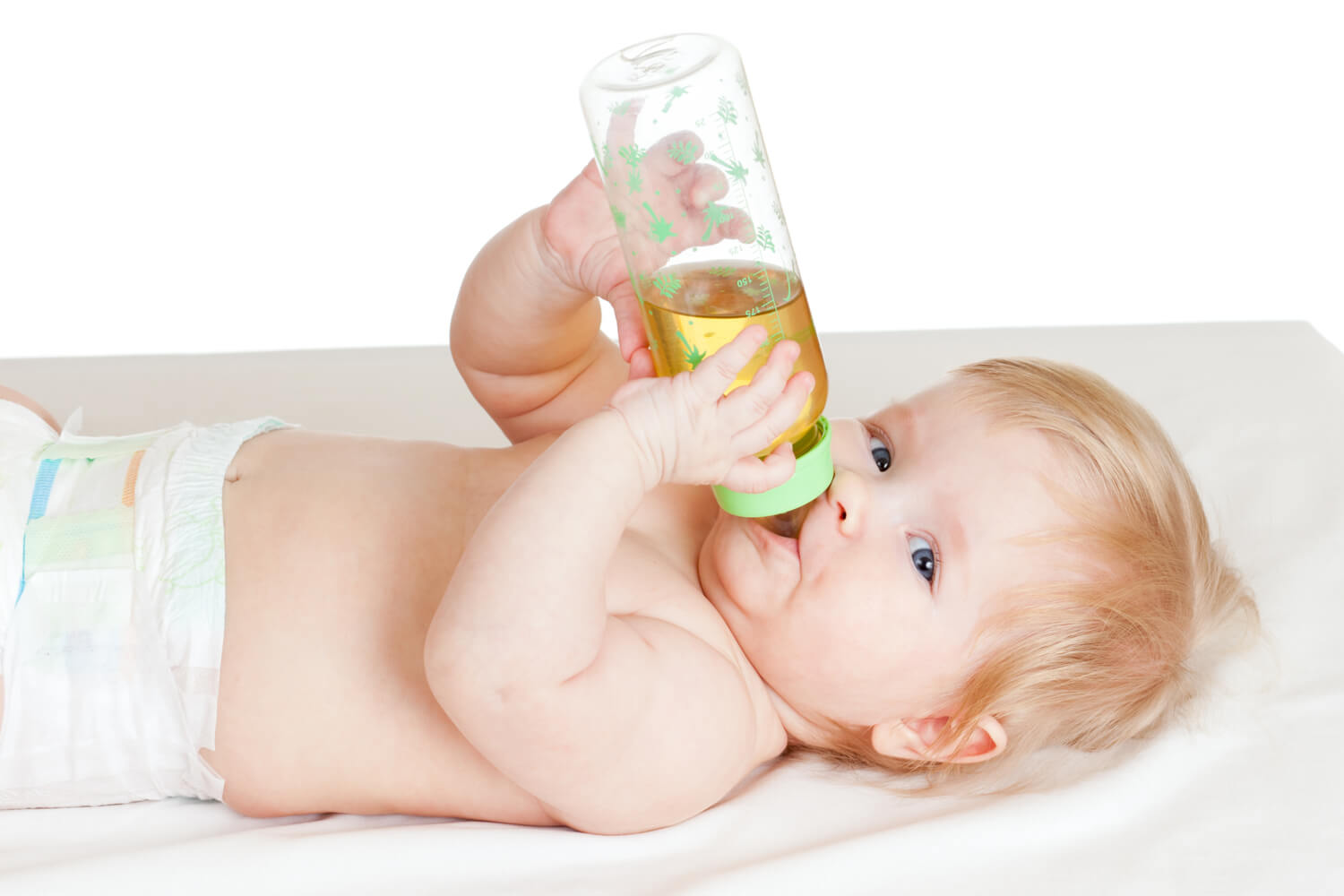 baby drinking fennel tea in bottle