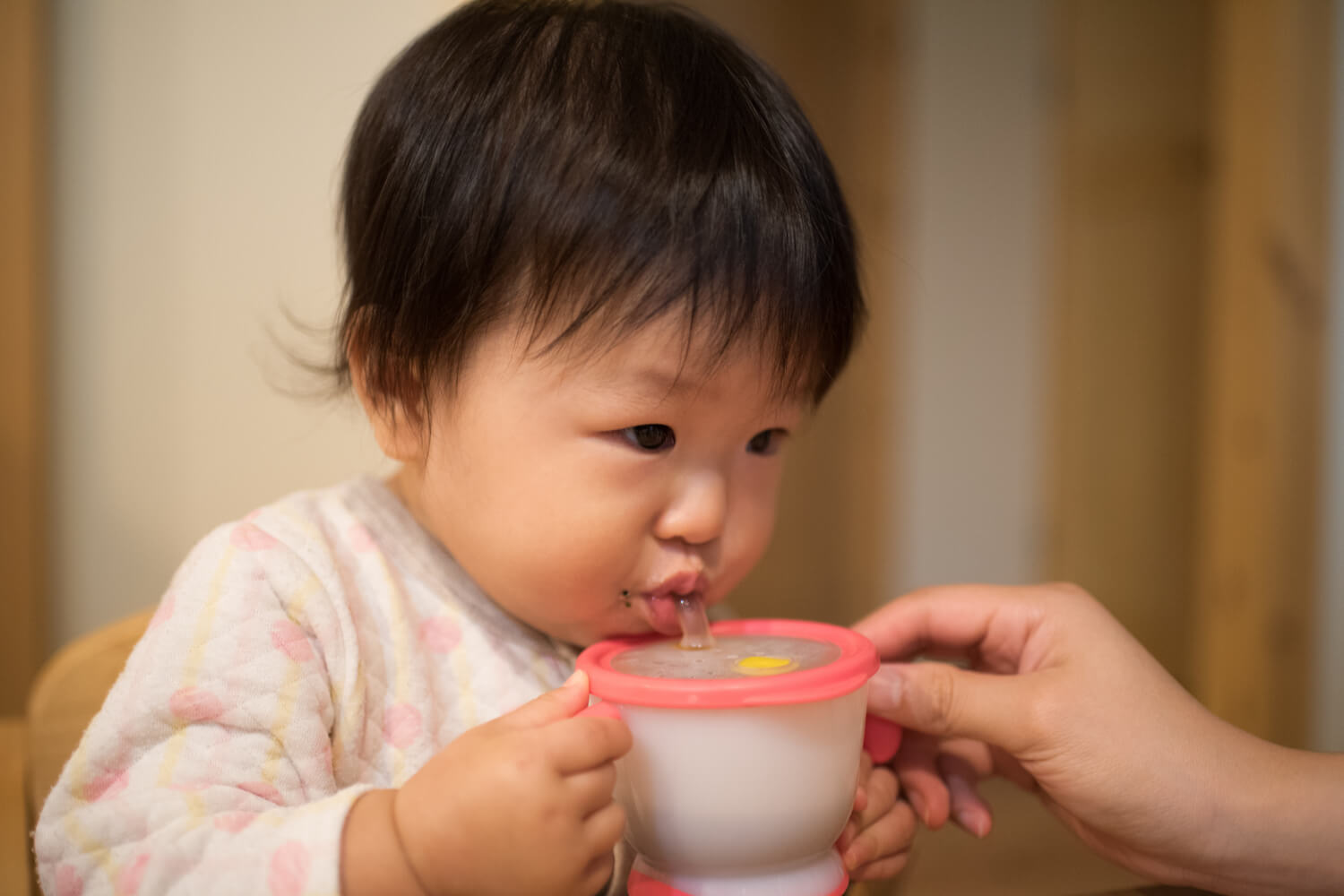 baby drinking rice milk