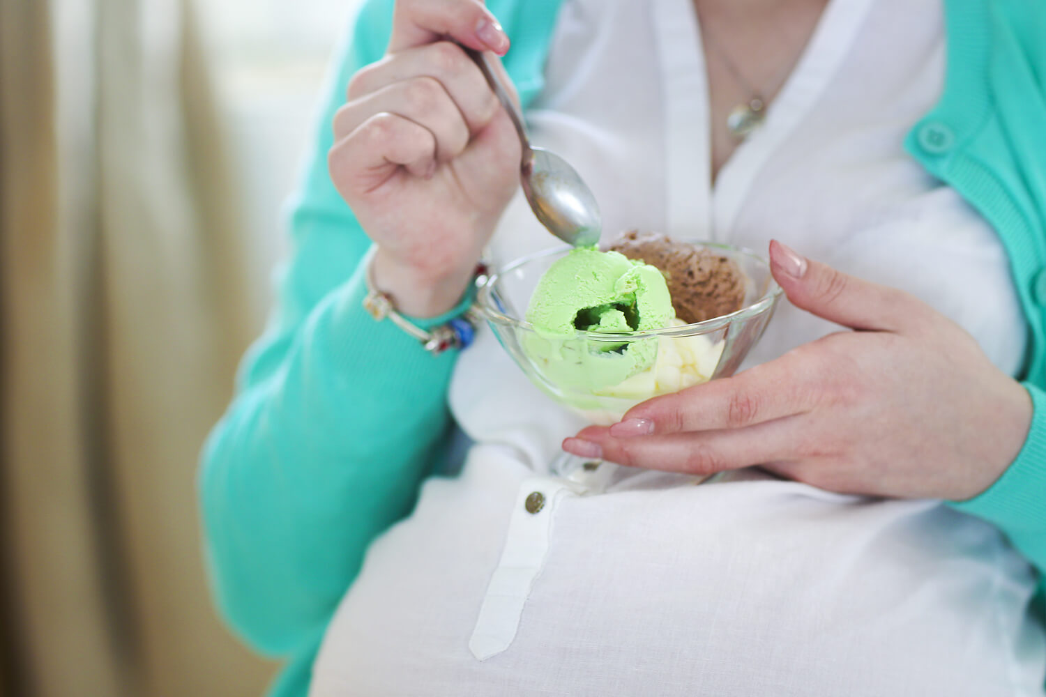 pregnant women eating ice cream