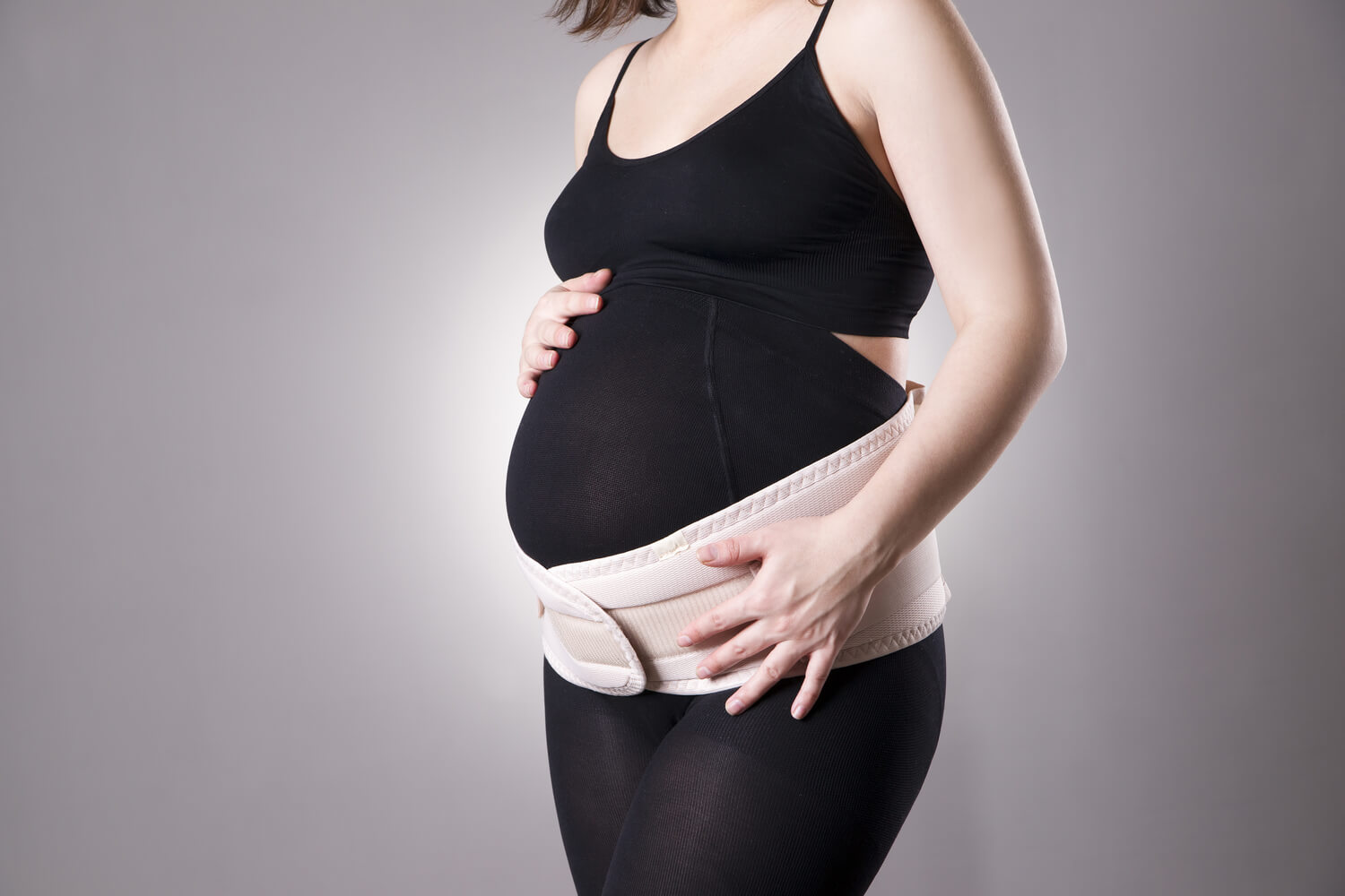 pregnant woman wearing belly belt