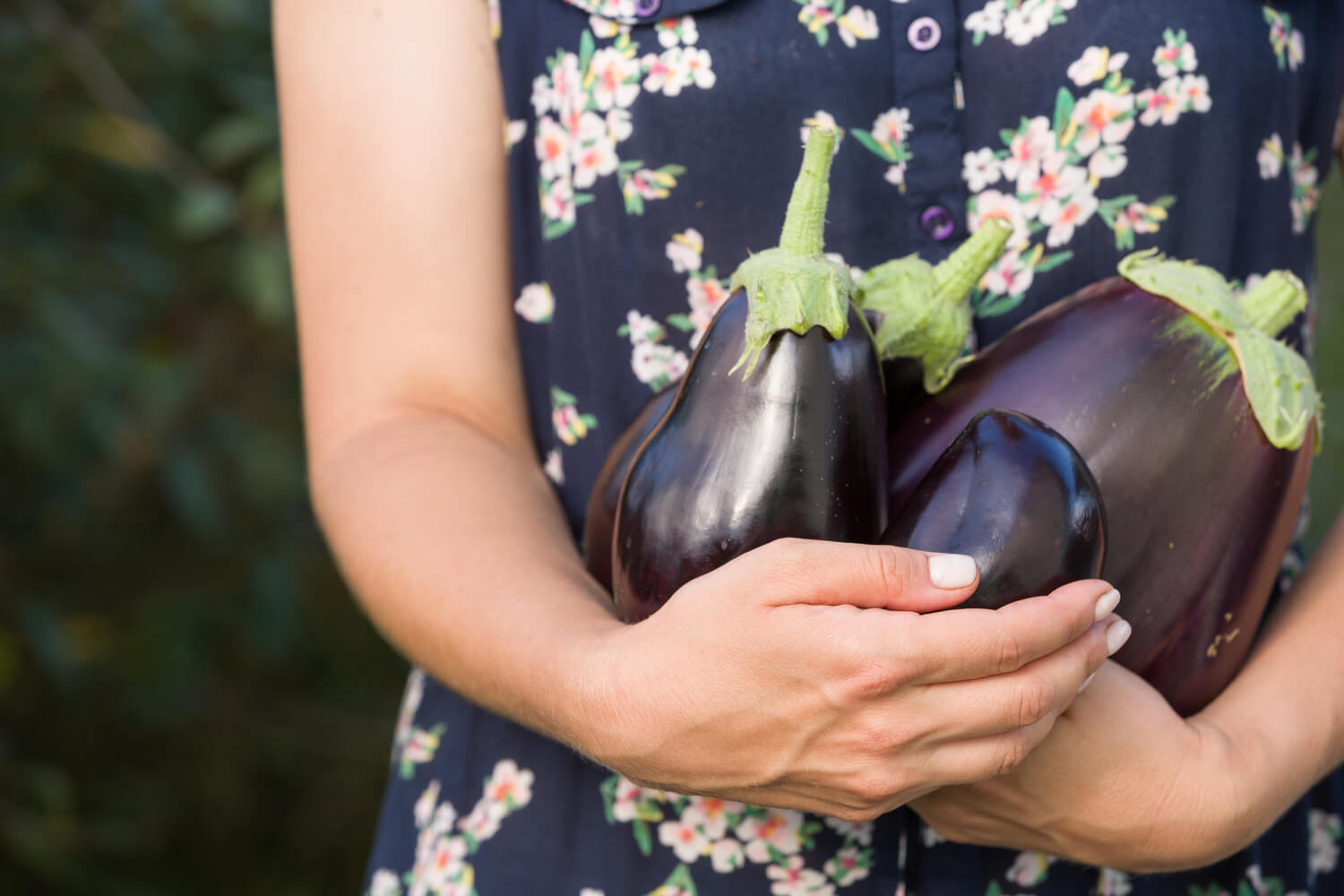 woman holding egg plant