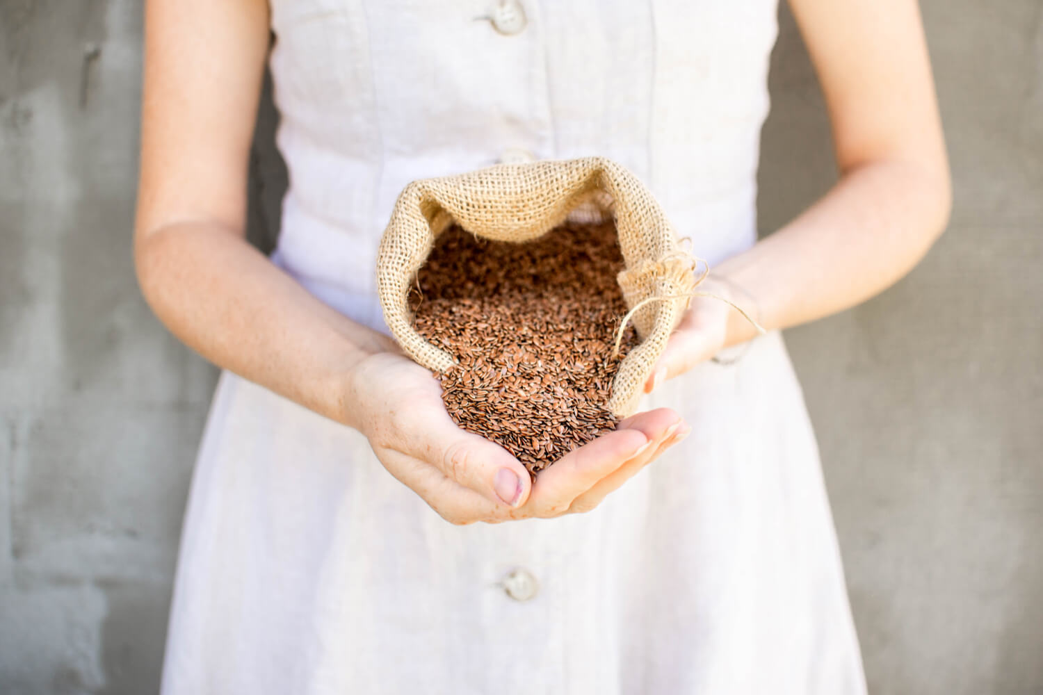 woman with flax seeds