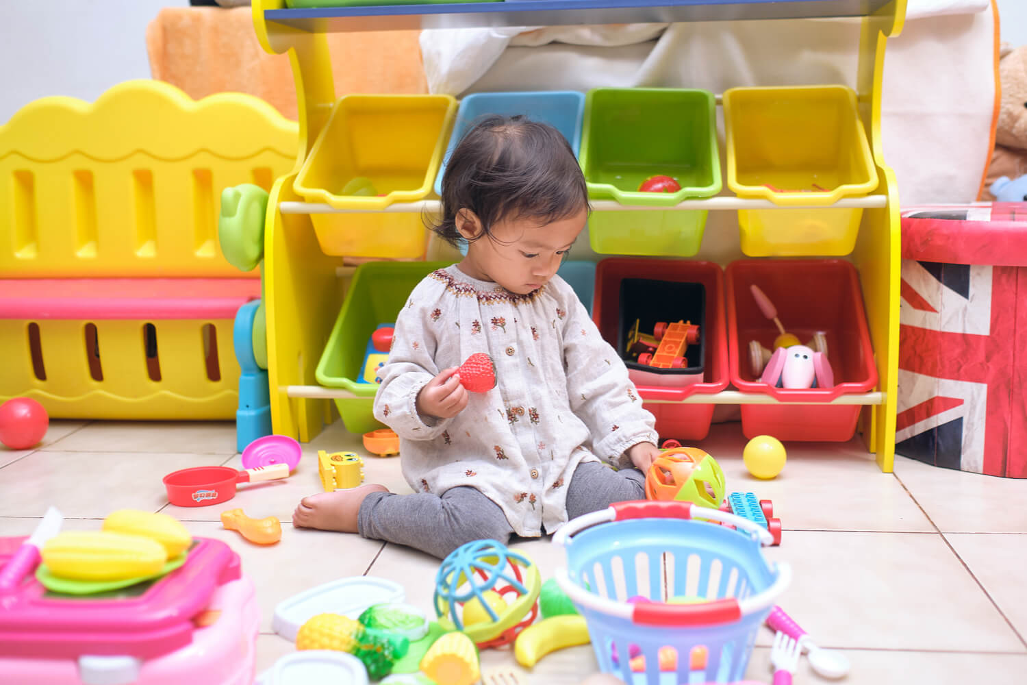 girl sitting W posture and playing