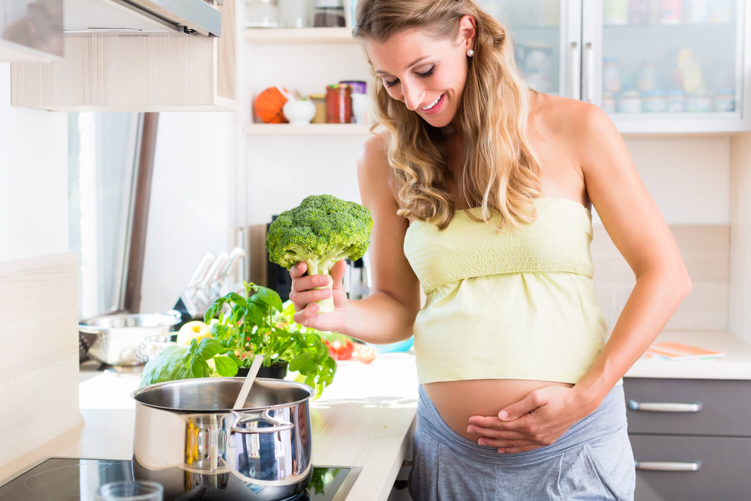 pregnant woman with broccoli