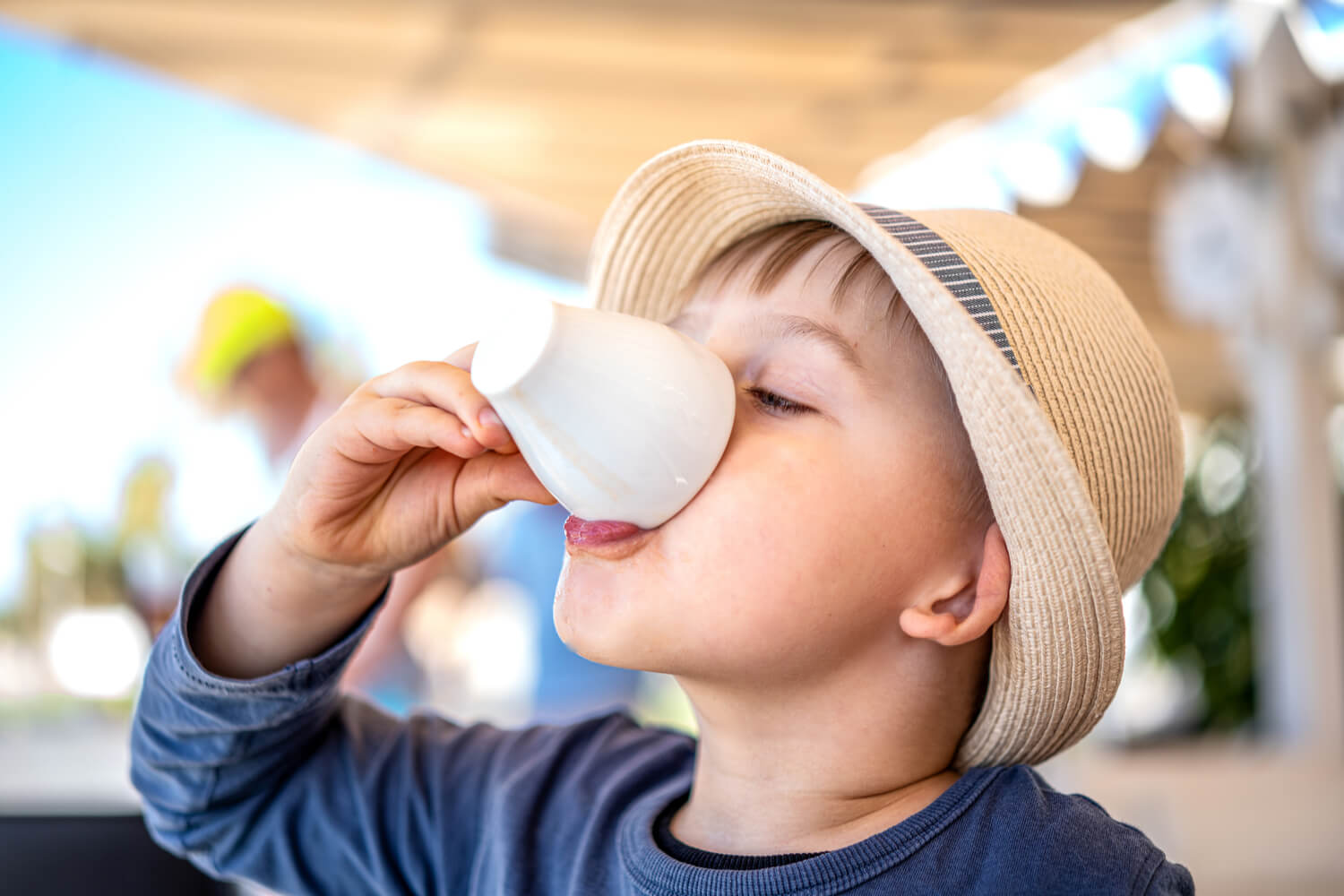 toddler drinking in a cup