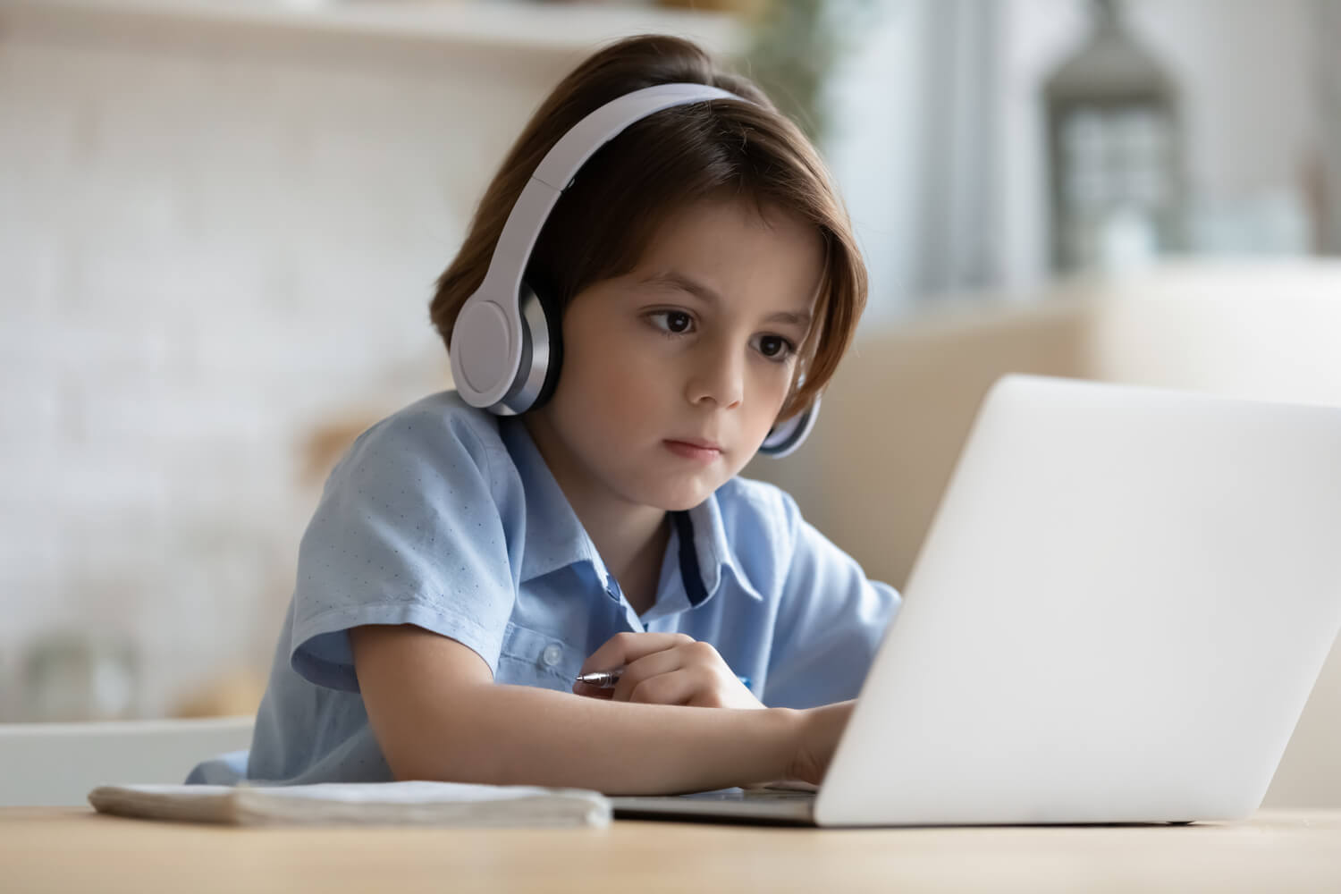 girl attending online with headphone