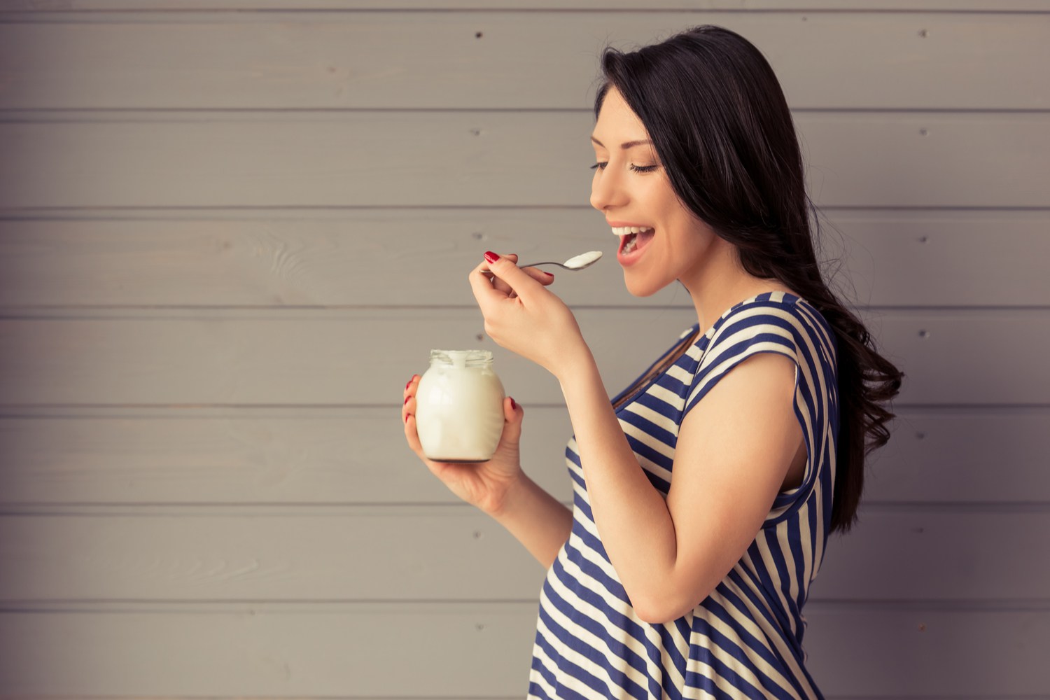 Pregnant Woman Eating Yogurt