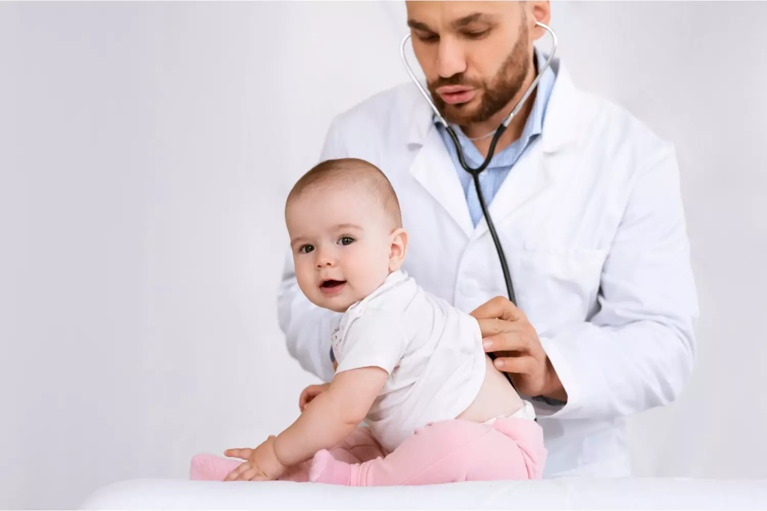 doctor checking a baby